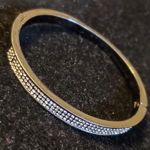 Gunmetal hinged oval bangle bracelet with clear rhinestones